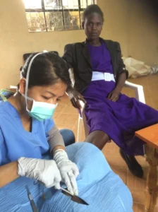 Healthcare worker treating a patient
